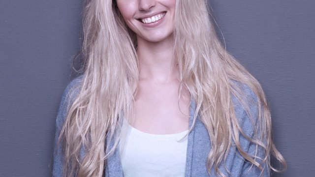 beautiful-blond-woman-smiling-PAEGR7C.jpg
